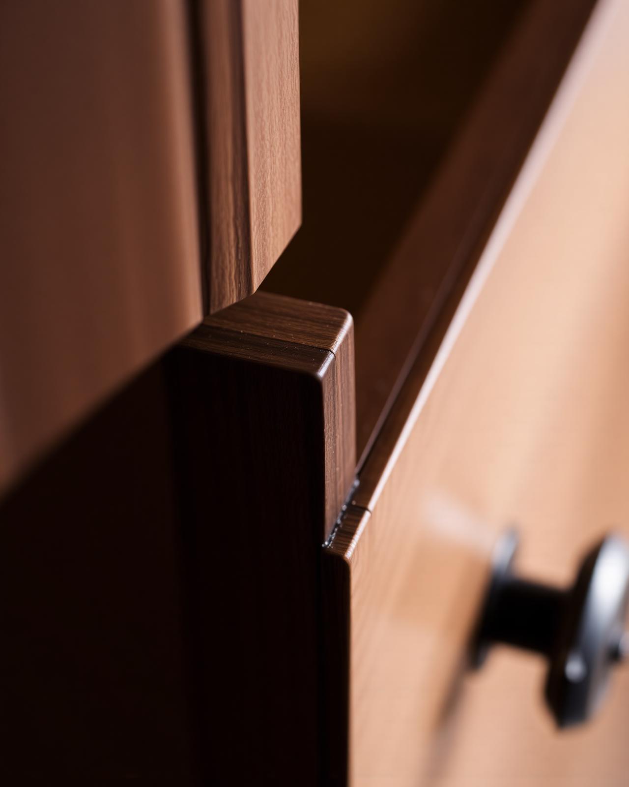 Close detail of fine cabinetry showing wood grain and a precise joint